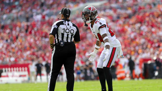 Oct 22, 2023; Tampa, Florida, USA; Tampa Bay Buccaneers cornerback Carlton Davis III (24) talks to line judge Maia Chaka (100) after a play against the Atlanta Falcon in the third quarter at Raymond James Stadium. Mandatory Credit: Nathan Ray Seebeck-USA TODAY Sports